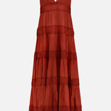 The Rune Lace Panel Maxi Dress by RONNY KOBO is a sleeveless rust maxi dress with a deep V-neck, spaghetti straps, tiered ruffled lace panels, and a flowy bohemian style, shown against a plain white background.