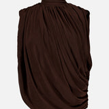 The Sav Draped Sleeveless Top by RONNY KOBO is an elegant women’s blouse in chocolate brown, featuring a sleeveless, draped silhouette with a high gathered turtleneck and ruched detailing, beautifully showcased against a plain white background.