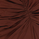 The Scorpio Ruched Waist Dress by RONNY KOBO features chocolate brown fabric gathered along a central seam to create flattering, radiating folds and a chic ruched texture.