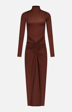 The Scorpio Ruched Waist Dress by RONNY KOBO is a chocolate brown column dress with long sleeves, a mock turtleneck, and a fitted bodice. Ruched waist detailing creates a draped effect on its mid-length skirt.