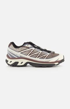 The SALOMON XT-6 Shadow Sneaker, displayed in brown, black, and beige from a side view, features a textured upper, quick-lace system, enhanced cushioning, and a rugged sole engineered for durability in outdoor pursuits.
