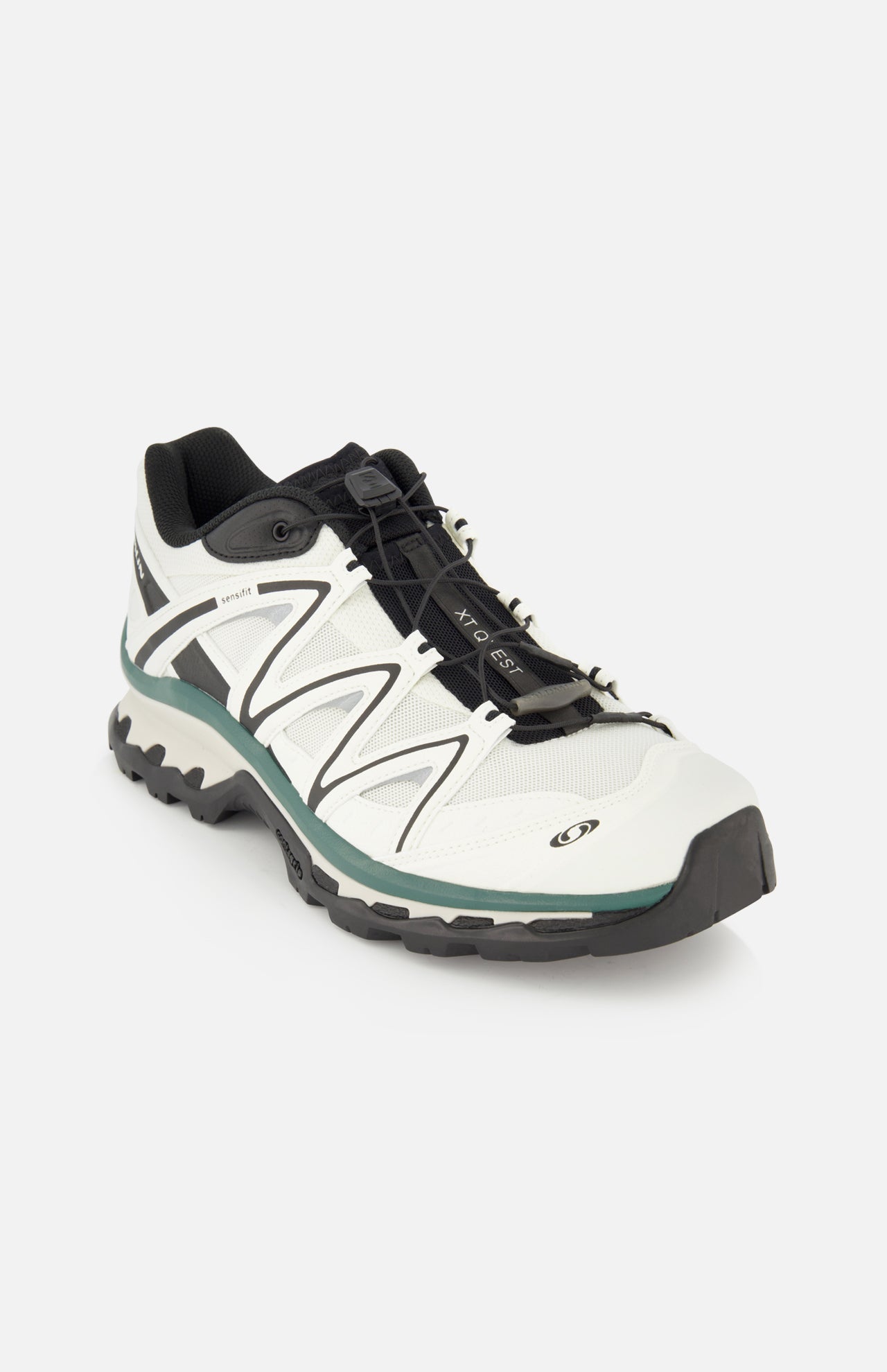 Introducing the SALOMON XT-Quest Sneaker—a white and black hybrid performance shoe featuring a low-profile design, resilient black sole, breathable mesh fabric, and quick-pull lacing system. Engineered to deliver both urban wearability and exceptional stability and grip for trail runs, this athletic sneaker is showcased against a plain white background.