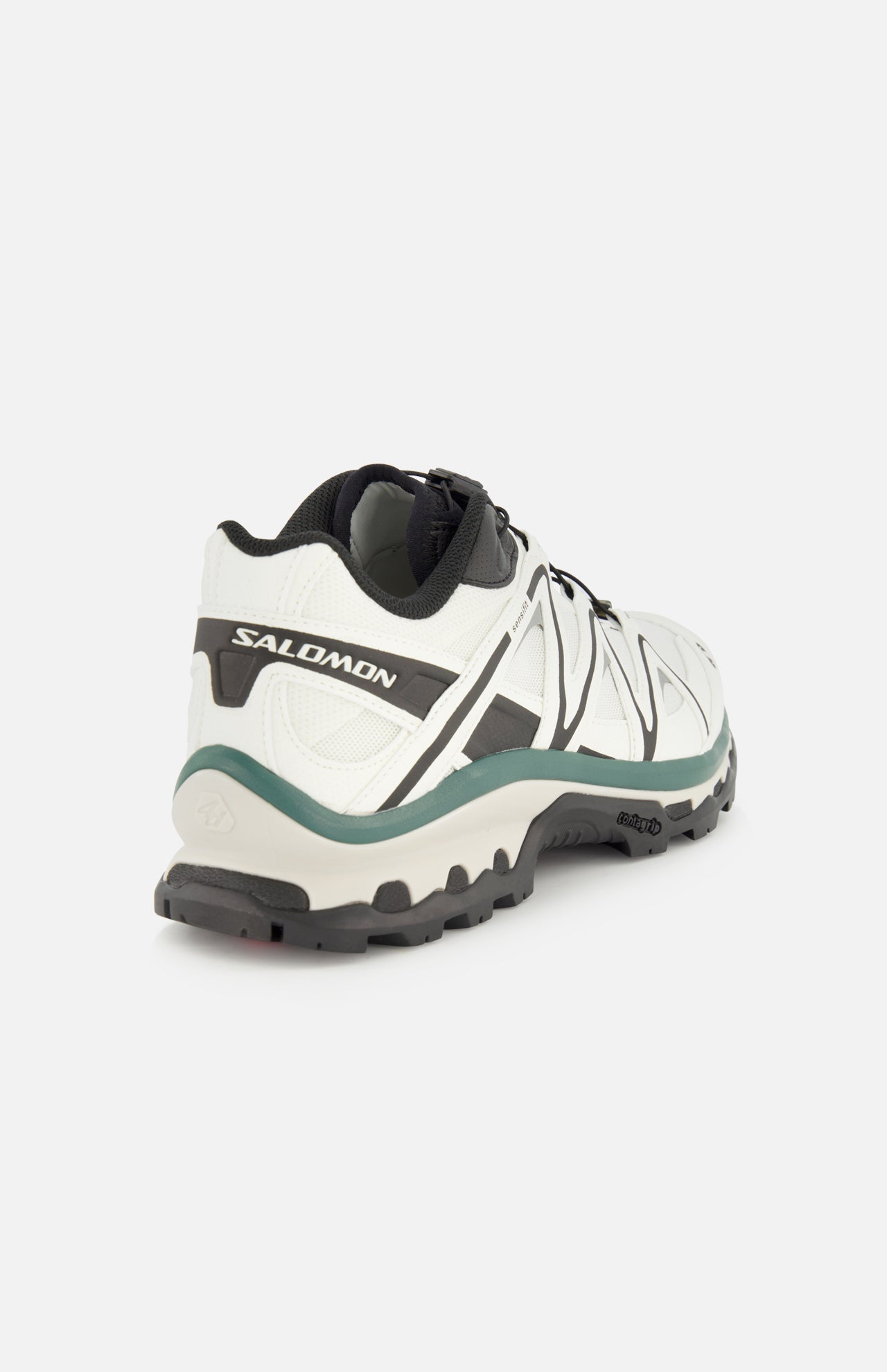The SALOMON XT-Quest Sneaker in a white and black colorway is displayed from a rear side angle against a plain white background, showcasing its hybrid performance design for optimal stability and grip—making it perfect for both challenging trails and everyday urban wear.