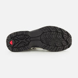 The image displays the black rubber outsole of the SALOMON XT-Quest Sneaker, showcasing its textured tread pattern engineered for stability and grip, along with a subtle red accent near the heel—a feature that makes this hybrid performance sneaker well-suited for urban wearability.