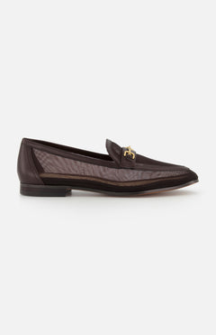 The SAM EDELMAN Loraine Mesh Equestrian-inspired Loafer features dark brown color, a low heel, sheer mesh side panels, and an equestrian-inspired gold bit buckle on the upper, shown against a white background.