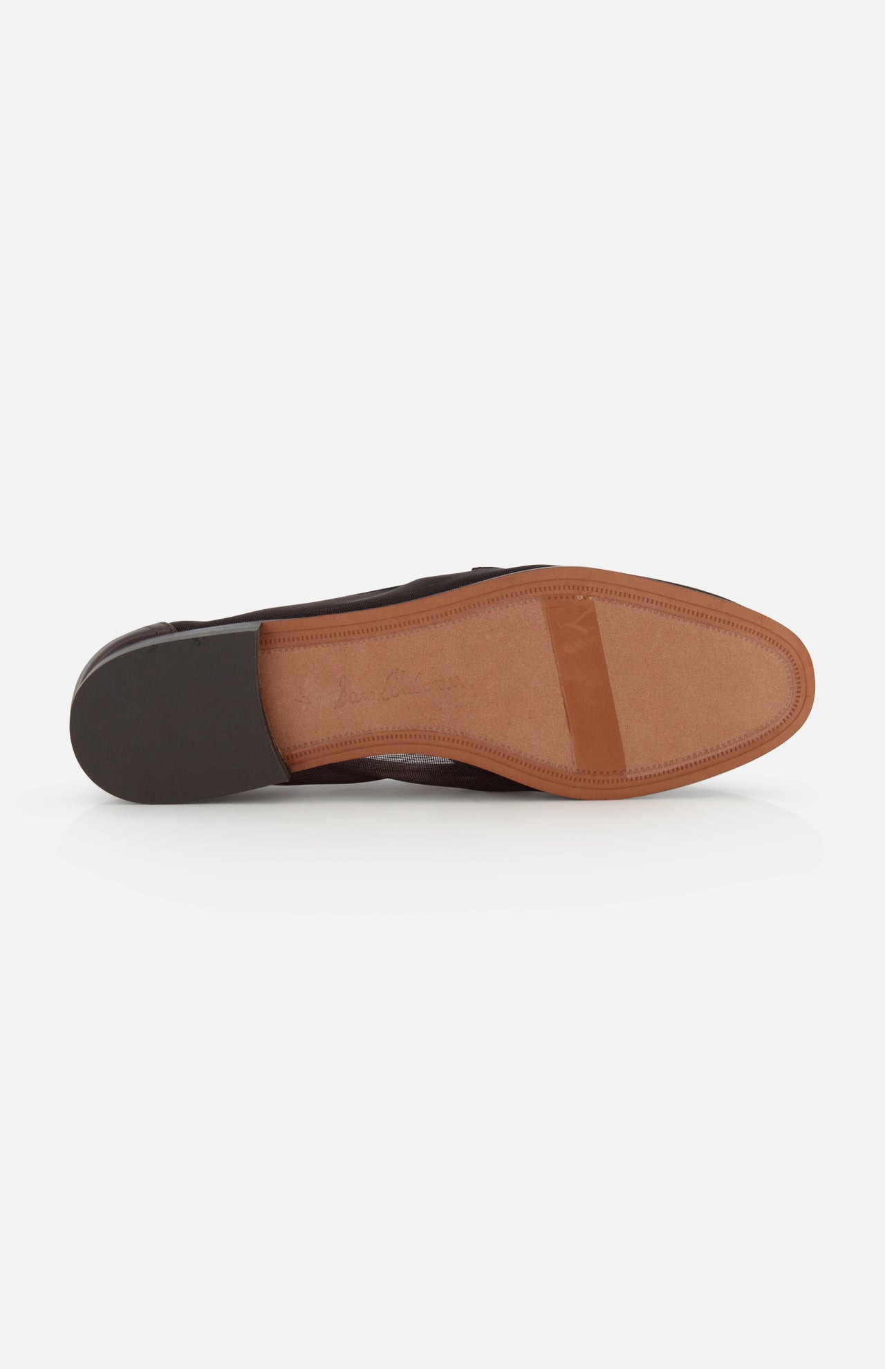The SAM EDELMAN Loraine Mesh Equestrian-inspired Loafer is a brown leather shoe shown from the bottom, featuring a light tan sole, dark brown heel, and a rectangular rubber grip near the toe for traction.