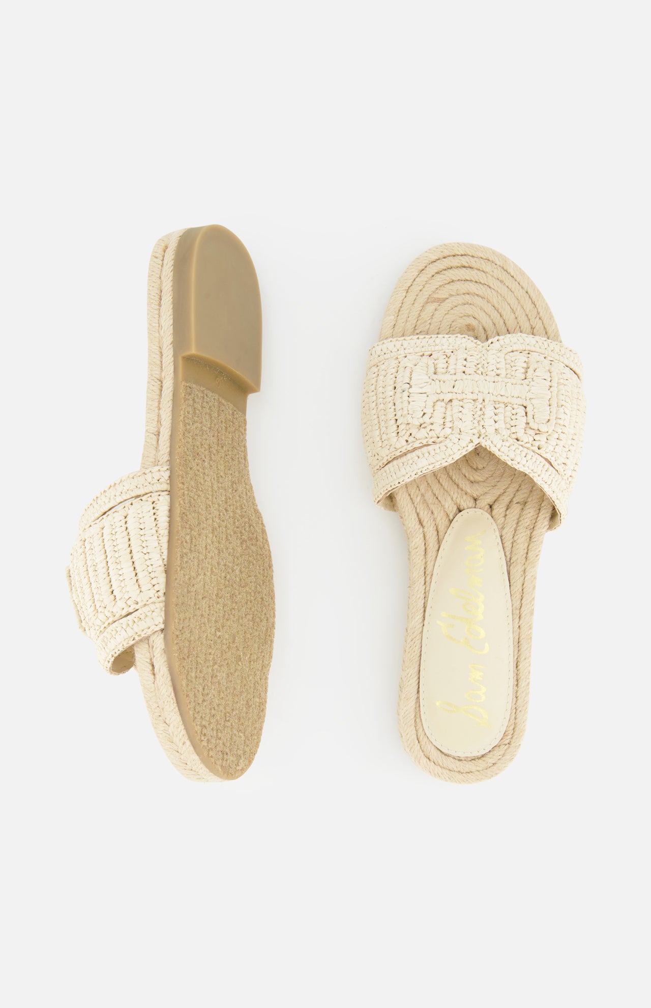 The SAM EDELMAN Miya Woven Sandal features beige raffia with thick braided straps and flat soles; shown on a white background with one sandal in top view and the other displaying the sole.