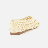 The SAM EDELMAN Shira Woven Leather Flat is an off-white slip-on with a square toe, closed heel, and open-weave design, shown from the back and slightly to the side on a plain white background.