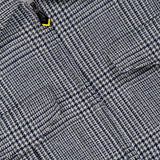 Close-up of a grey and navy Houndstooth Wool-blend Jacket by SARTORIO, featuring a zippered front.