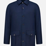 The SARTORIO Linen Flap Pocket Overshirt in navy blue features a collar, long sleeves, and two front flap pockets, shown against a plain light gray background.