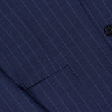 Close-up of the SARTORIO Pinstripe Wool Suit, crafted from virgin wool in Italy. Features classic navy pinstripes, black buttons, tailored details, and a visible lapel showcasing the fabric's refined texture.