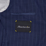 Close-up of the inside of a navy Pinstripe Wool Suit by SARTORIO, featuring white lining and a black "SARTORIO" label with yellow stitching, highlighting this elegant Italian-made virgin wool sportcoat.