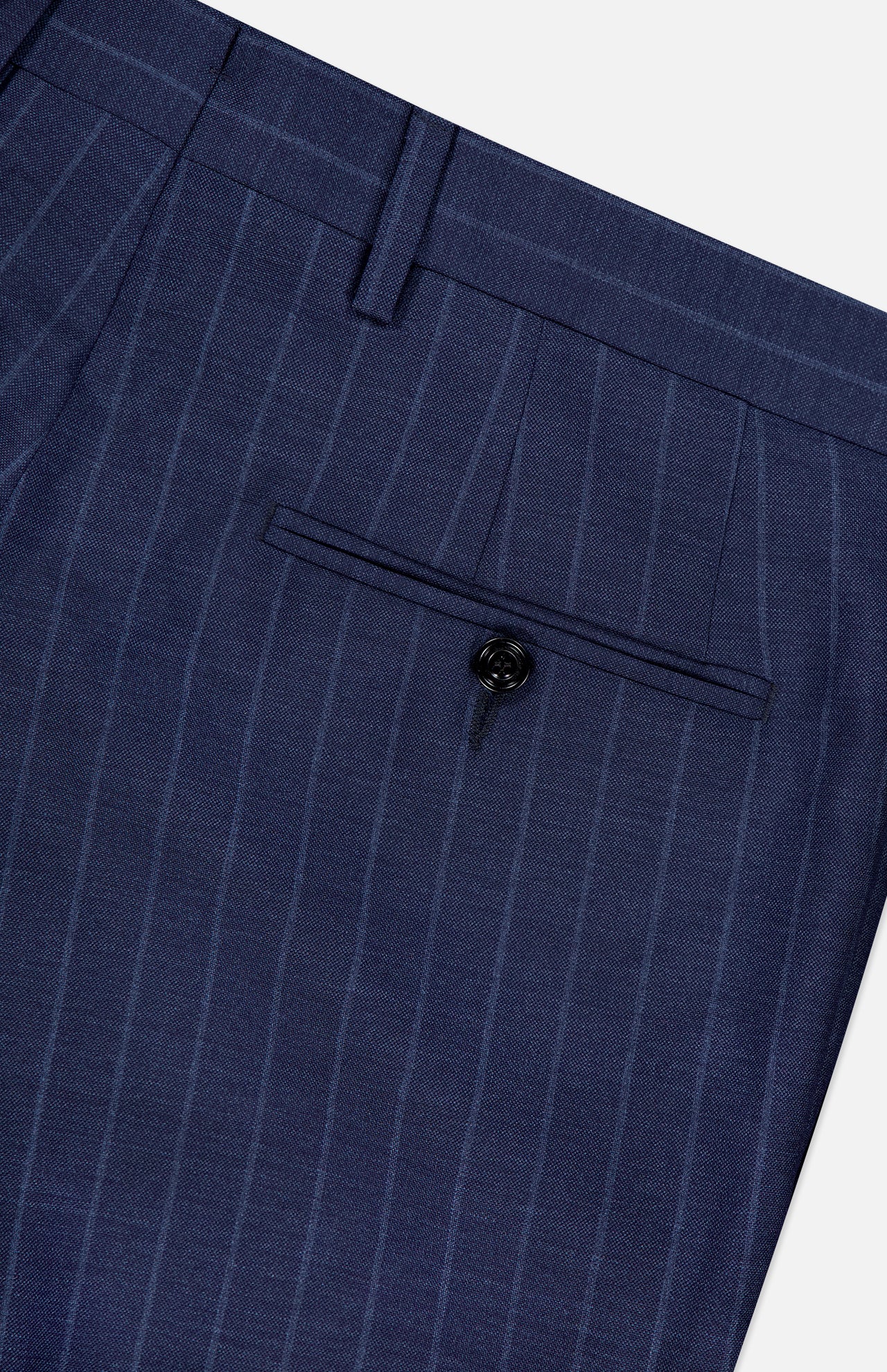 Close-up of the back pocket on SARTORIO's Pinstripe Wool Suit pants, featuring a single black button and a belt loop above, showcasing meticulous craftsmanship.