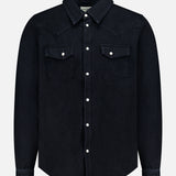 The Allen Denim Shirt by SAVAS is a black, long-sleeve shirt crafted in Los Angeles, featuring white snap buttons and two chest pockets, shown against a plain white background.