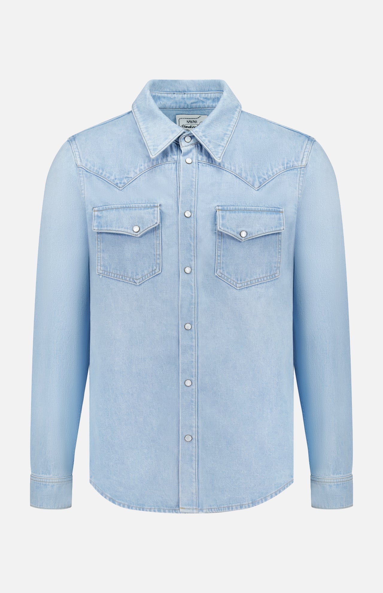 The SAVAS Allen Denim Shirt is a light blue Japanese selvedge denim shirt with snap buttons, two flap chest pockets, and a pointed collar, made in Los Angeles and shown against a plain white background.