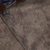 Close-up of the SAVAS Condor Calf Suede Shearling Collar Peacoat, featuring rich brown suede, a luxuriously soft removable shearling collar, and three prominent buttons along the front—expertly crafted in Italy for outstanding quality.