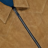 Close-up of the SAVAS Legend Calf Suede Jacket for men, in tan suede, showcasing a silver zipper, pointed collar, and hint of blue lining.