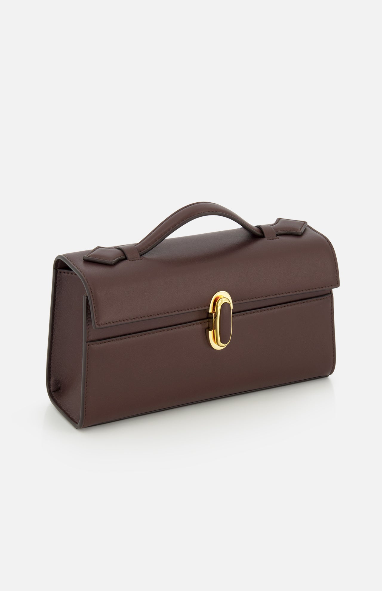 The Symmetry Pouchette Bag by Savette features a structured, rectangular silhouette in brown leather with a top handle and gold clasp, exuding quiet luxury on a white background. Meticulously crafted in Italy, this timeless and elegant piece showcases exceptional design and craftsmanship.