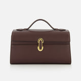 The Symmetry Pouchette Bag by Savette is a brown leather handbag that exudes quiet luxury, featuring a short handle, rectangular silhouette, and elegant gold clasp on the front. Set against a plain white background, this timeless accessory is expertly made in Italy.