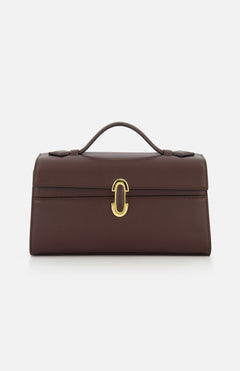 The Symmetry Pouchette Bag by Savette is a brown leather handbag that exudes quiet luxury, featuring a short handle, rectangular silhouette, and elegant gold clasp on the front. Set against a plain white background, this timeless accessory is expertly made in Italy.