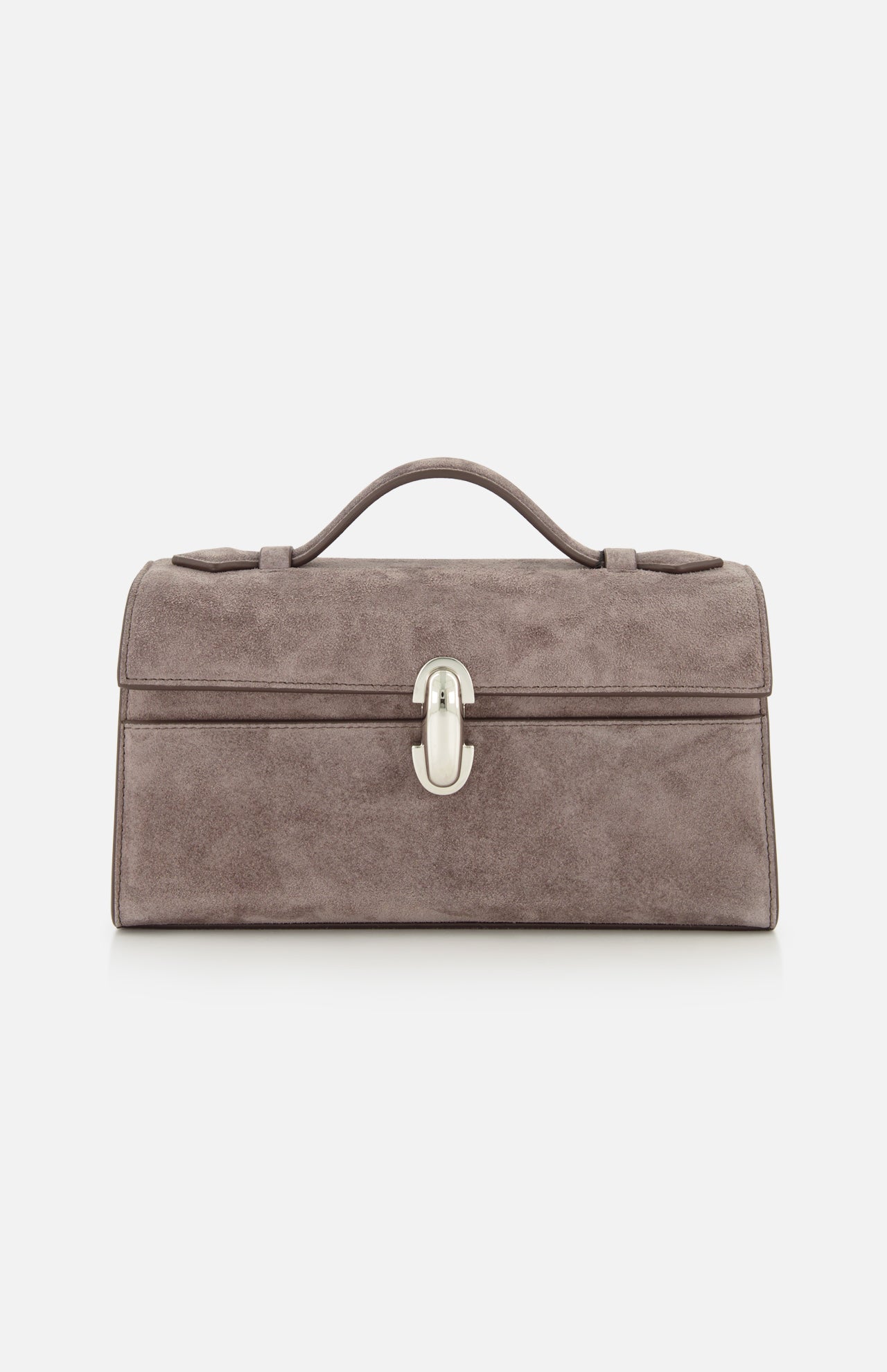 The Symmetry Pouchette Bag by Savette is a taupe suede handbag featuring a rectangular silhouette, top handle, and silver front clasp, expertly crafted in Italy and photographed against a white background—a refined example of quiet luxury.