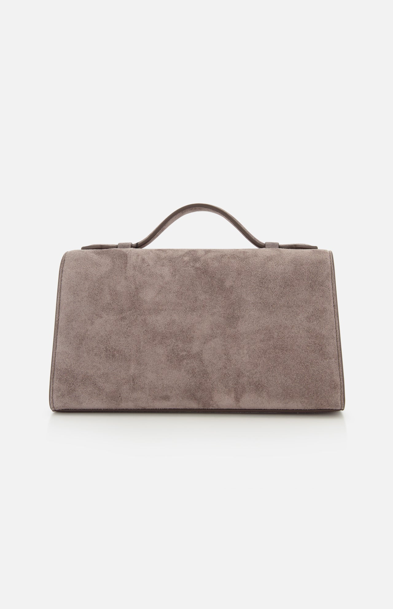 The Symmetry Pouchette Bag by Savette is a rectangular taupe suede handbag with a short top handle, embodying the understated elegance of quiet luxury, shown against a plain white background.