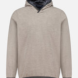 The SEASE Drone Hooded Pullover is a beige sweatshirt made in Italy, featuring long sleeves, a dark inner lining, and a high-low hem, shown against a plain white background.
