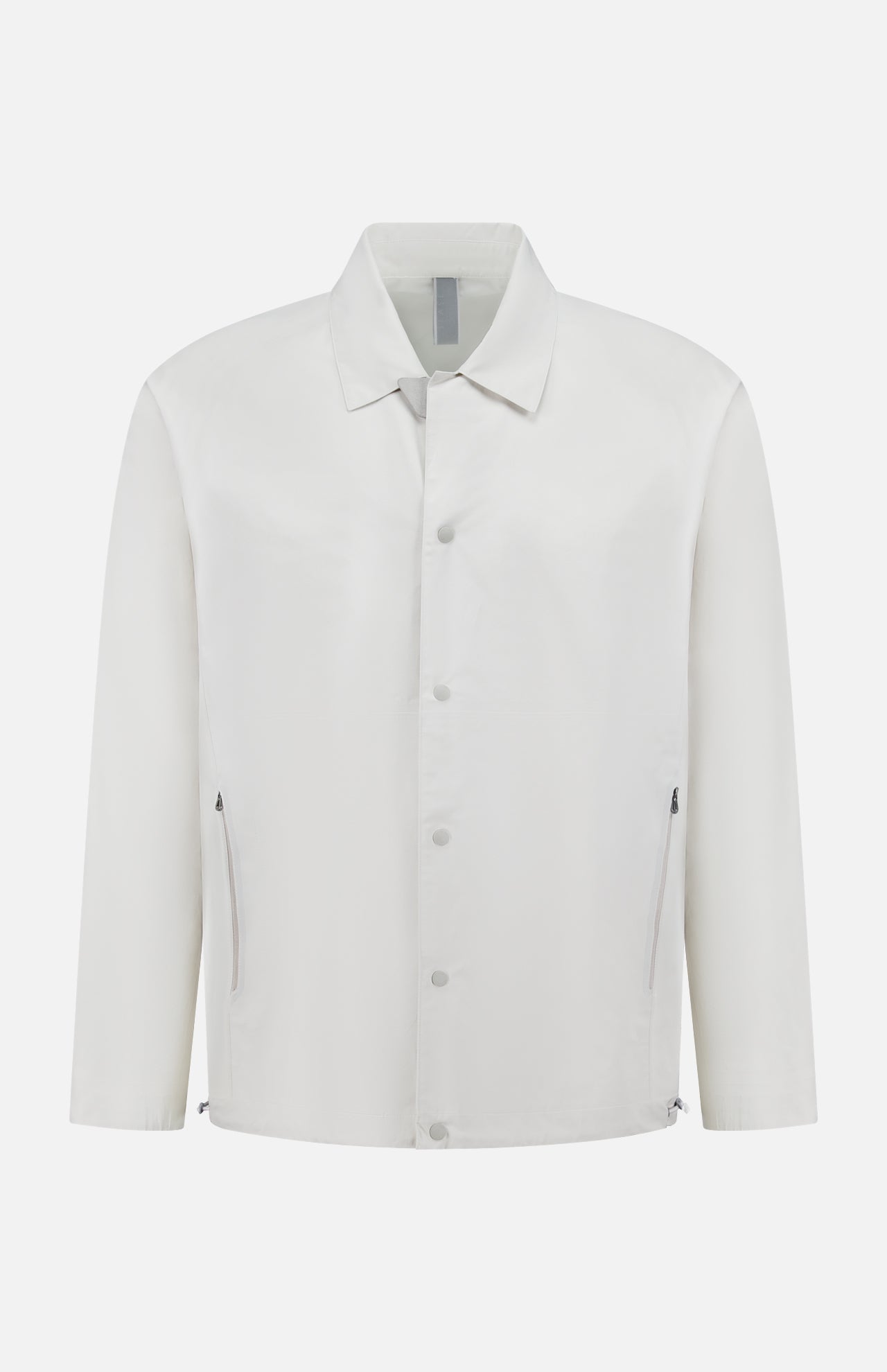 The SEASE Spring Lifetime Drawcord Jacket in pearl grey features a collar, snap-front closure, and two zipped side pockets, exemplifying minimalist outerwear against a white background.