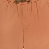 Close-up of SEASE Summer Mindset Drawstring Trouser Pant in light brown, featuring a green adjustable drawstring at the elastic waist and a simple, minimal design.