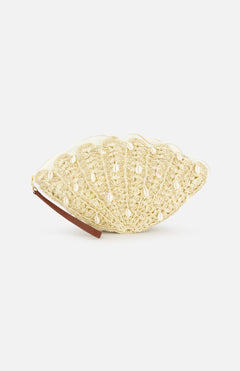 The SENSI STUDIO Seashell Embroidered Clutch is a handcrafted woven bag with intricate shell patterns and embellishments, plus a small brown strap, shown against a white background.