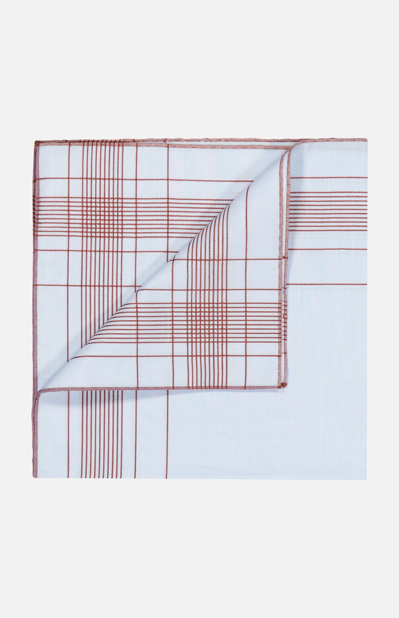 Harlan Cotton Pocket Square in light blue with a red grid pattern and a folded corner, styled in the tradition of a French fashion house.