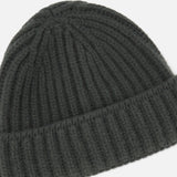The DORIANI Cashmere Beanie in dark gray features a ribbed texture and folded brim, shown against a white background.