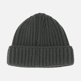 A DORIANI Cashmere Beanie in dark gray, featuring a ribbed design and a folded brim, is displayed against a plain white background.