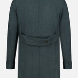 The DORIANI Double Breasted 180′s Jersey Coat is showcased from the back in dark gray, featuring a notched collar, long sleeves with cuffs, and a back belt detail fastened with two buttons. Expertly crafted in Italy from luxurious virgin wool, it offers timeless style and exceptional quality.