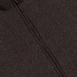 Close-up of the DORIANI Fur 180′s Jersey Bomber Jacket, handmade in Italy from a dark brown melange wool, featuring a diagonal silver zip closure with branded pull tab and a black collar trim.