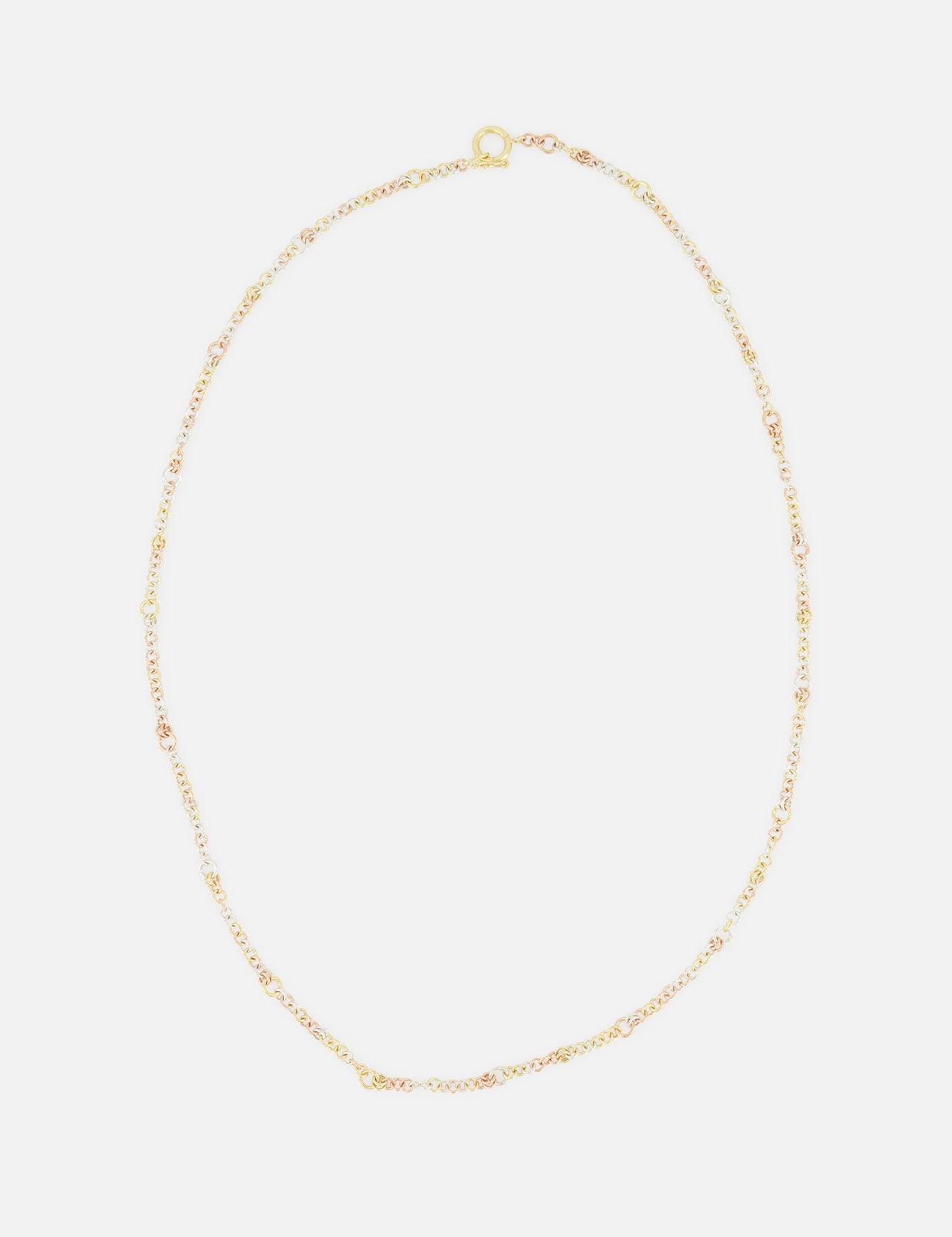 The SPINELLI KILCOLLIN Gravity Chain 20" Necklace features fine gold links and a small clasp, elegantly displayed in a loose oval on a white background—ideal for layering or pairing with modular jewelry.
