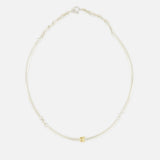 The Hello Tria Silver Necklace by SPINELLI KILCOLLIN features a simple sterling silver chain accented with three gold rings, shown against a plain white background.