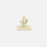 The SPINELLI KILCOLLIN Libra Gris Diamond Ring is displayed upright on a beige ring stand against a plain white background.
