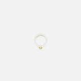 The Phantom SK Ring by SPINELLI KILCOLLIN is a minimalistic sterling silver and yellow gold ring with a small gold accent, shown against a plain white background.