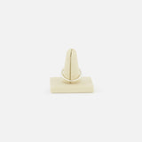The SPINELLI KILCOLLIN Sirius 3 Annulets Ring, a minimalist unisex gold jewelry piece, is shown upright on a beige velvet ring holder against a plain white background.