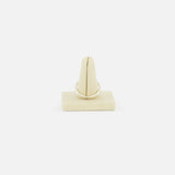 The SPINELLI KILCOLLIN Sirius 3 Annulets Ring, a minimalist unisex design, is displayed upright on a beige velvet ring holder against a plain white background.