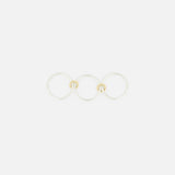 The SPINELLI KILCOLLIN Solarium SG 3 Band Ring features three sterling silver bands linked with gold connectors, showcasing minimalist modular design, set against a plain white background.