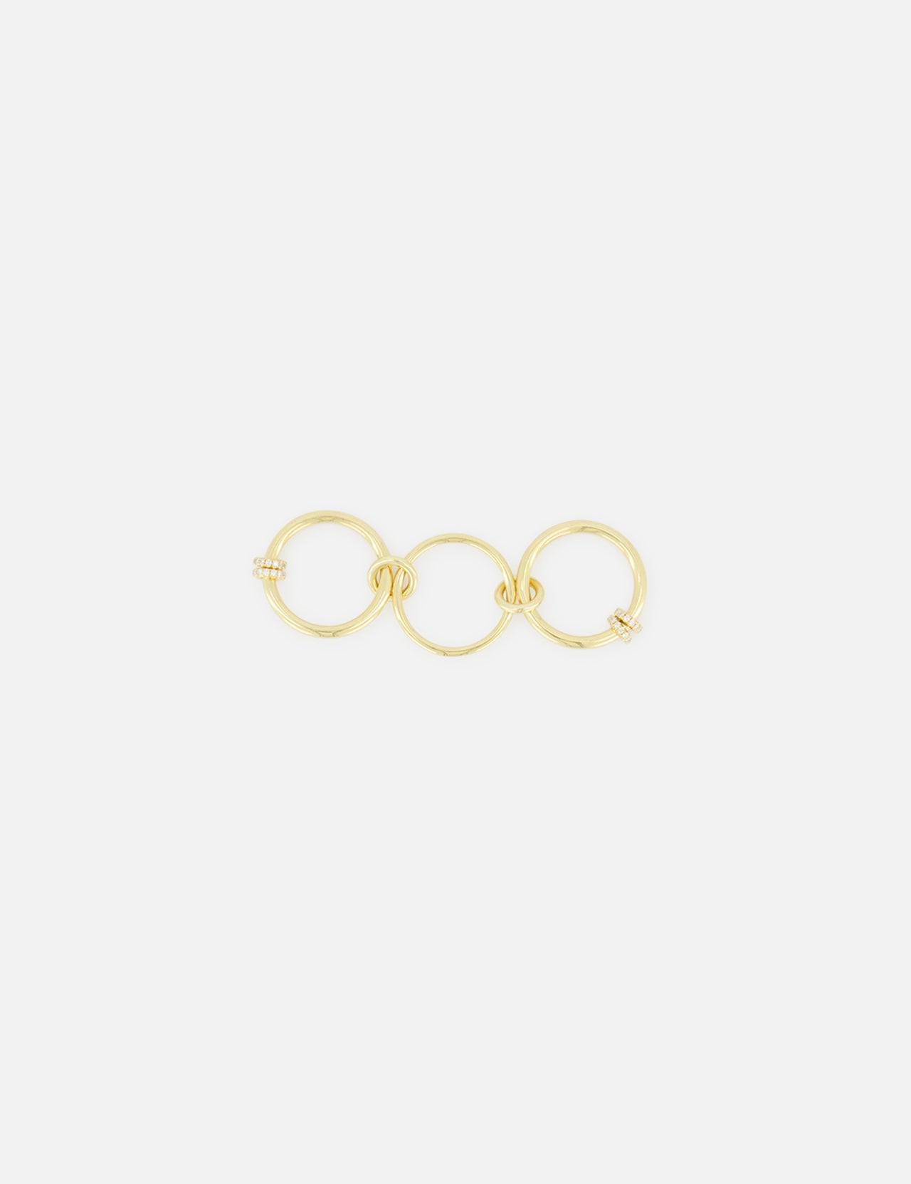 The Jovie Double Pave Ring by SPINELLI KILCOLLIN showcases two interlocking, subtly twisted circles adorned with pavé detailing, presented against a plain white background.