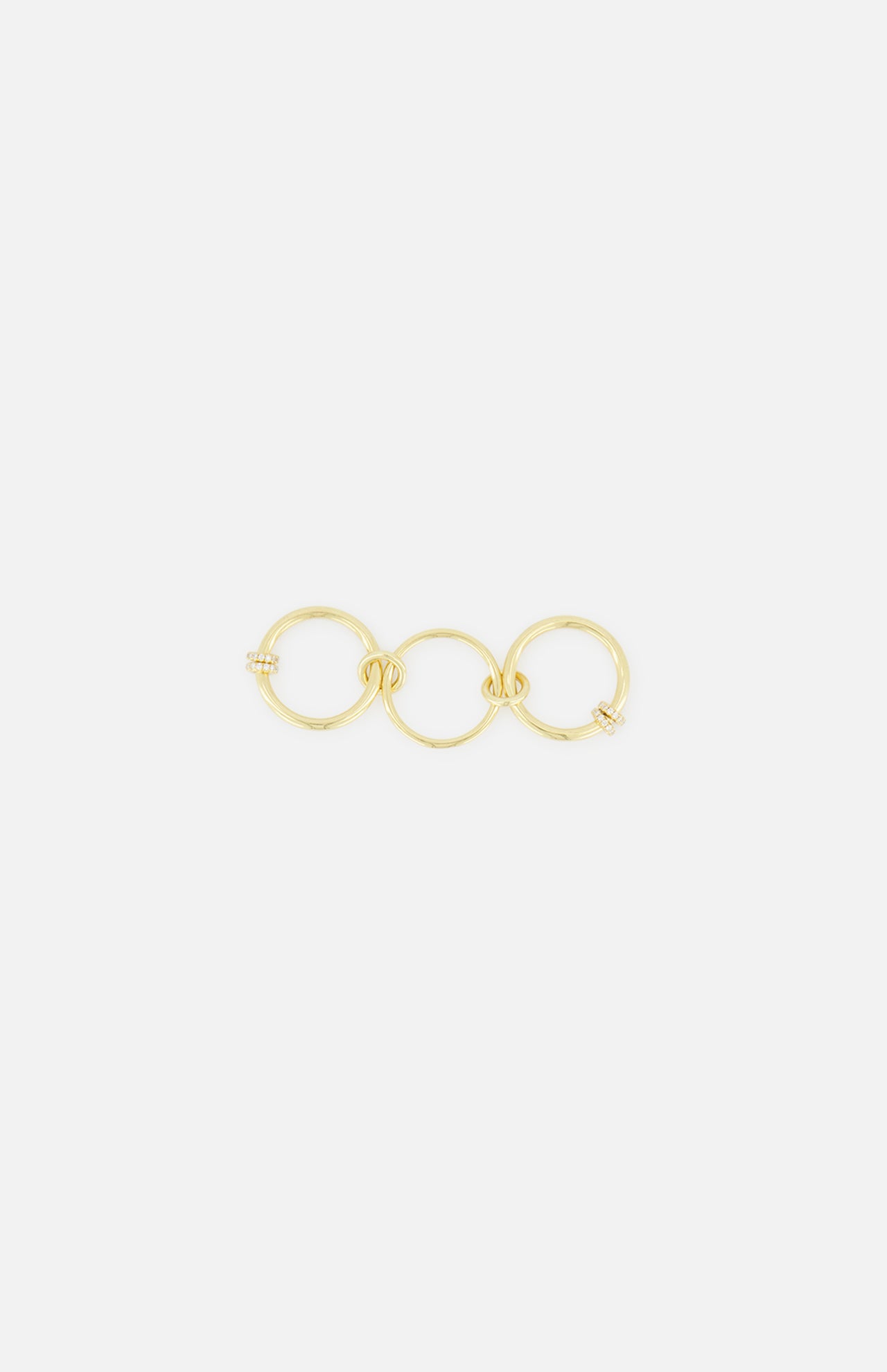 The Jovie Double Pave Ring by SPINELLI KILCOLLIN showcases two interlocking, subtly twisted circles adorned with pavé detailing, presented against a plain white background.