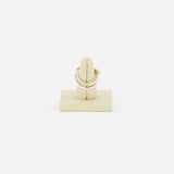 A SPINELLI KILCOLLIN Nimbus 4 Band Diamond Ring featuring small diamonds, shown on a beige ring holder against a plain white background.