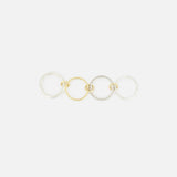 The SPINELLI KILCOLLIN Nimbus 4 Band Diamond Ring features four interlocking sterling silver and gold-tone bands, one accented with diamonds. Displayed on a plain white background.