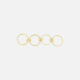 The Polaris 4 Band Ring by SPINELLI KILCOLLIN features four elegantly linked gold bands of varying sizes, arranged in a straight line against a plain white background.