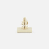 The Raneth 3 Band Ring by SPINELLI KILCOLLIN, crafted in sterling silver, is shown on a beige padded ring holder against a plain white background.