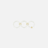 The SPINELLI KILCOLLIN Raneth 3 Band Ring features three linked sterling silver bands with subtle gold accents, displayed in a horizontal row on a plain white background.