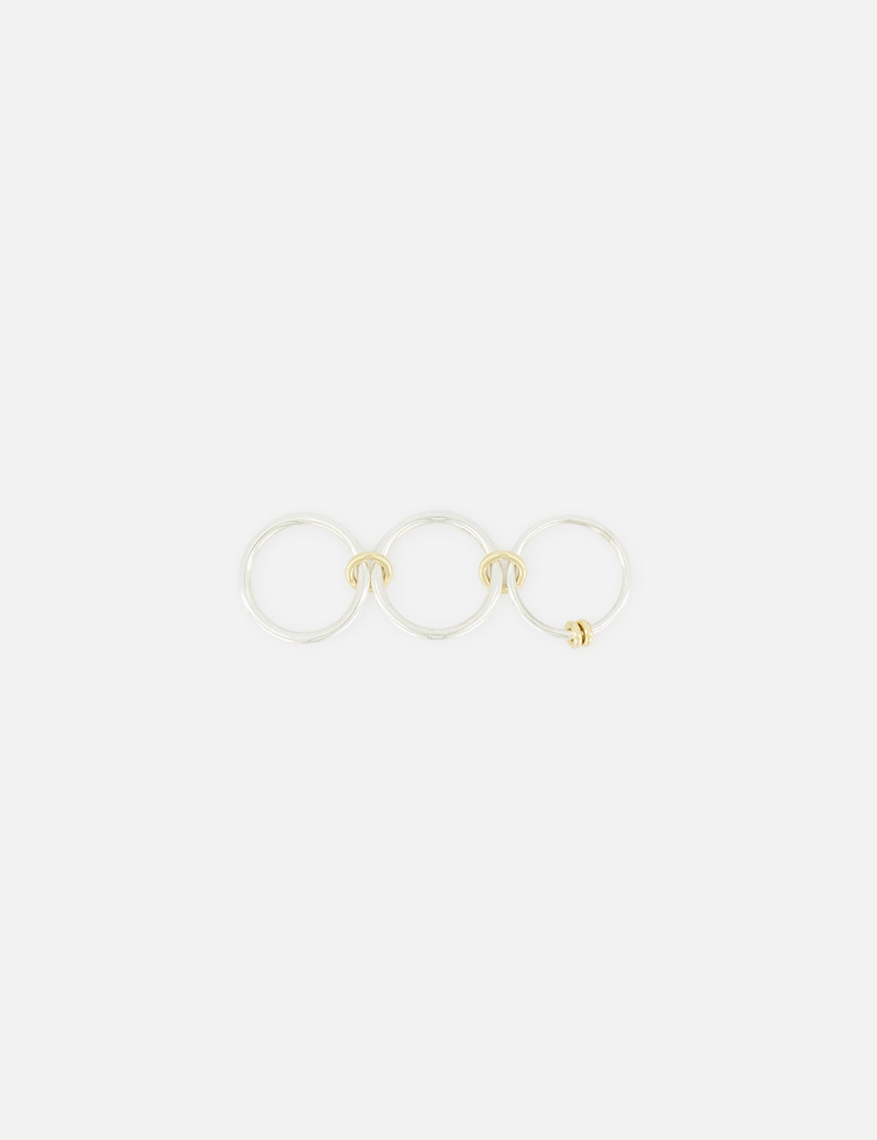 The SPINELLI KILCOLLIN Raneth 3 Band Ring features three linked sterling silver bands with subtle gold accents, displayed in a horizontal row on a plain white background.